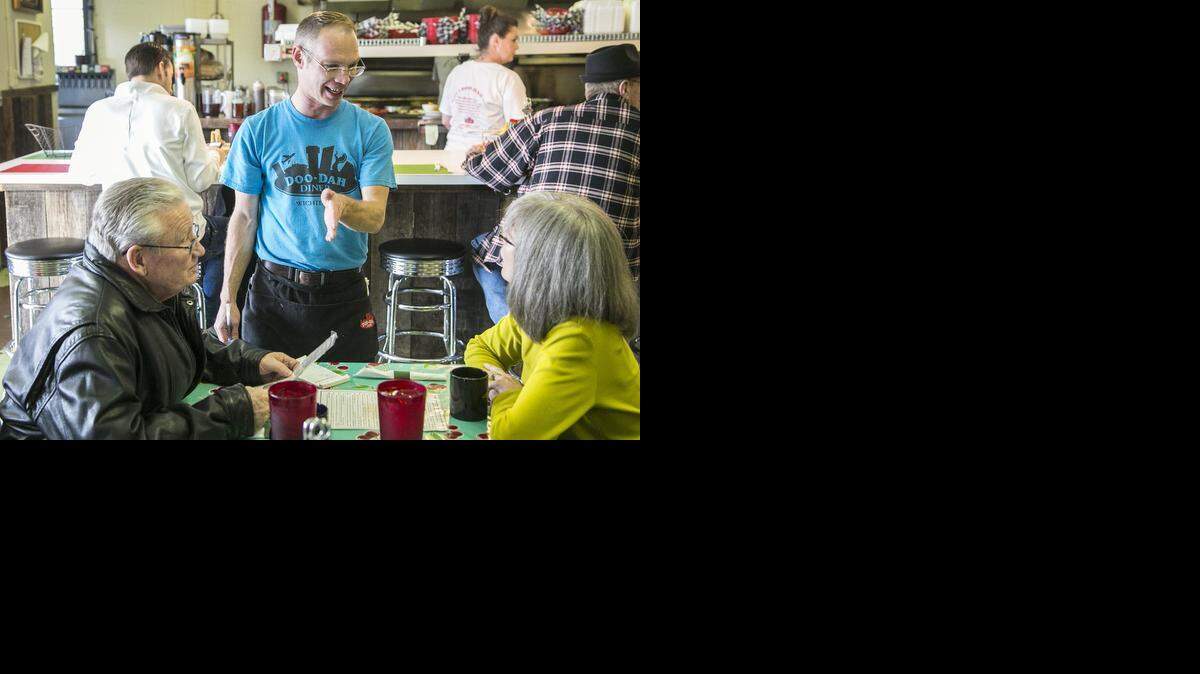 
Doo-Dah Diner waiter Brian Maixner, taking an order from customers Chuck and Debbie Hickman, was recently offered a new smile from a generous customer. 
