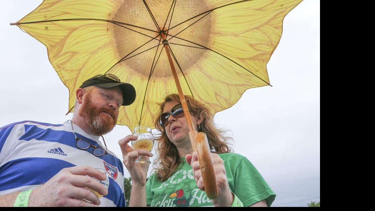 
Russell and Carissa Coleman sample beer Saturday during the Wichita Craft Beer & Food Fest in the Delano neighborhood.
