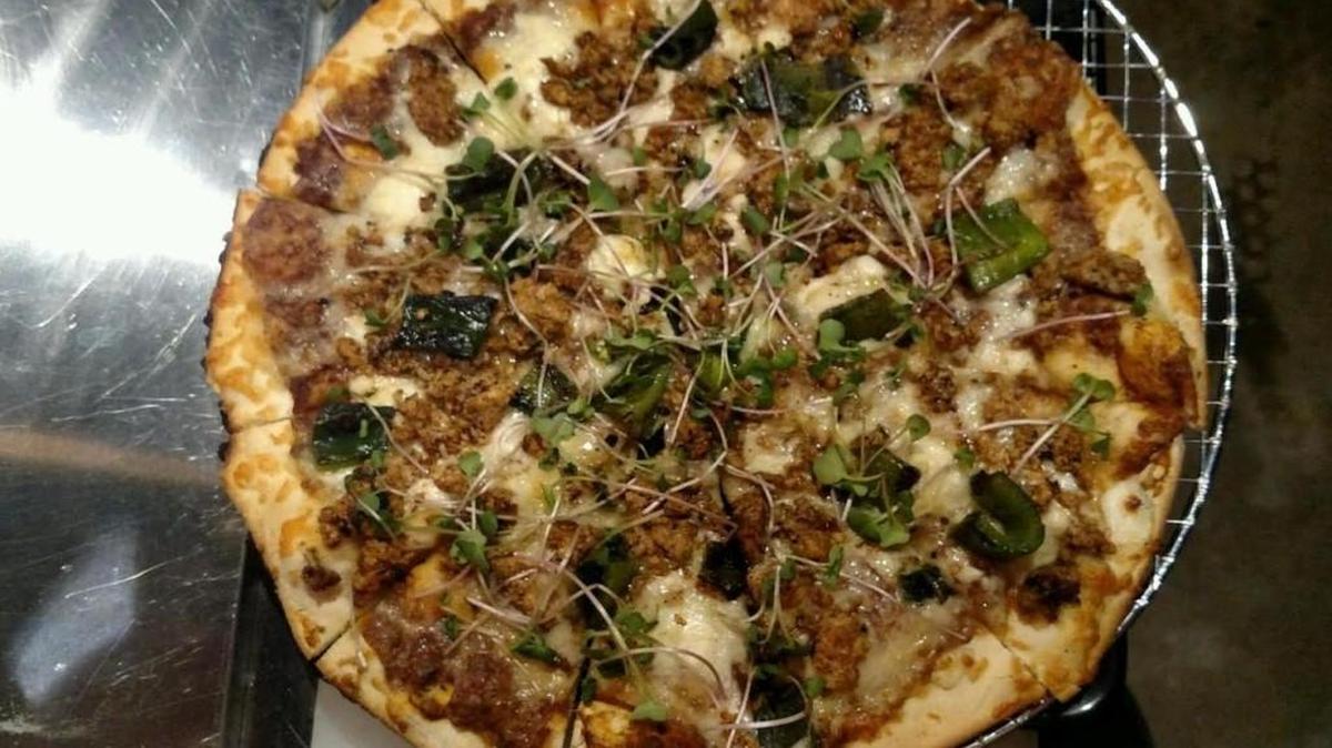The Oaxacan Tiayuda, which is a pizza-like tostada that’s popular in the Mexican state of Oaxaca, is District Taqueria’s contribution to a Wichita Brewing Company pizza-a-month promotion.