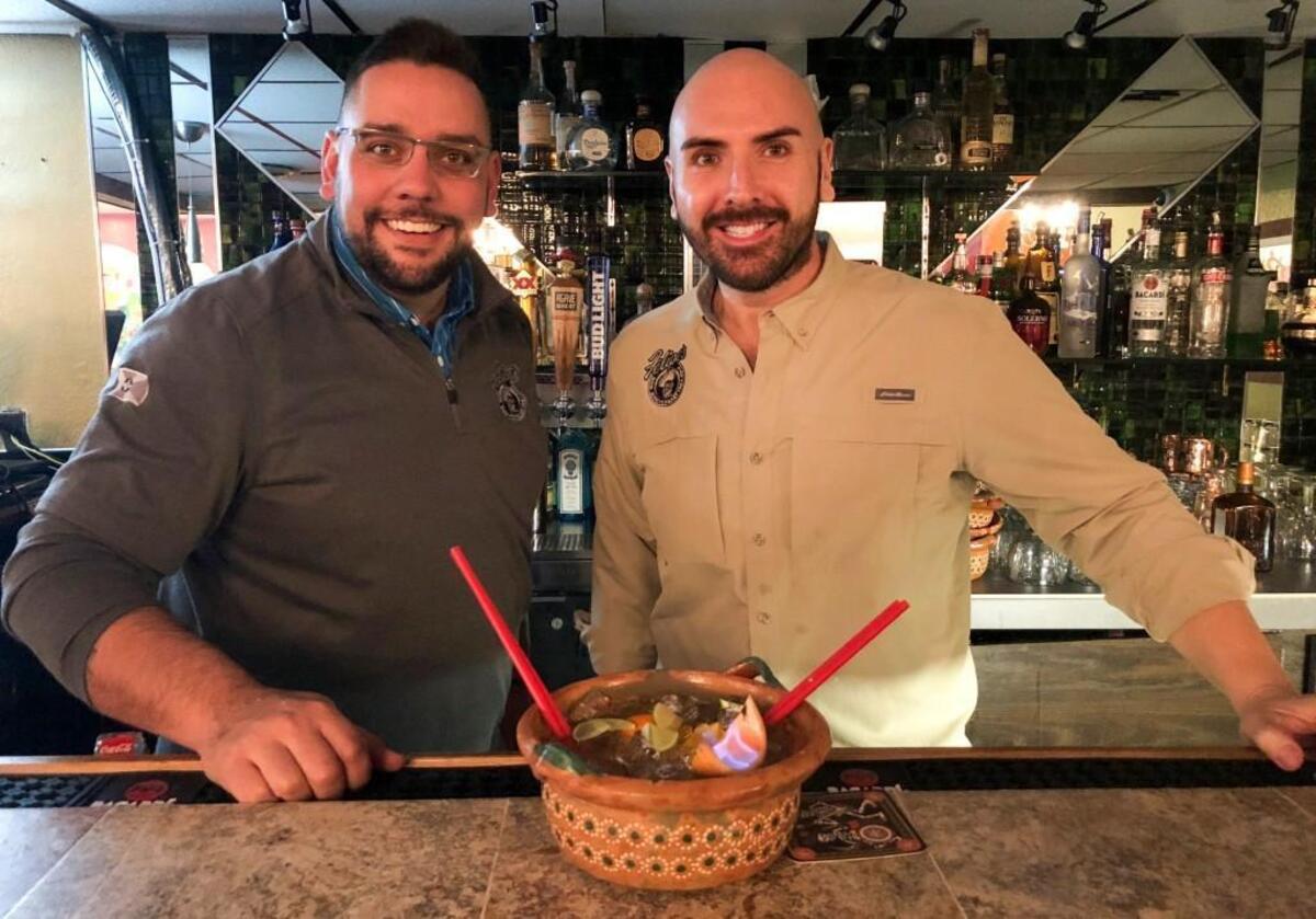 Felipe’s Mexican Restaurant owners Poncho and Felipe Lujano Jr. say their father, Felipe Sr., invented the restaurant’s famous Flaming Cazuela drink in the 1980s.