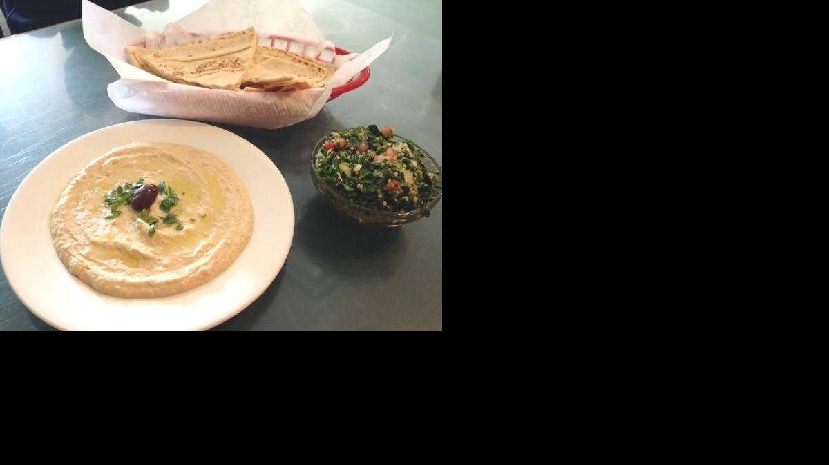 
Byblos’ specialties include hummus, foreground, and tabouli salad, right.
