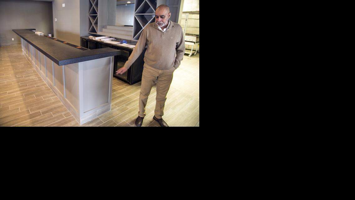 
Charli Singh, owner of Sweet Basil at 2424 N. Woodlawn, points to where the fire started last April in what used to be the kitchen. (March 3, 2015)
