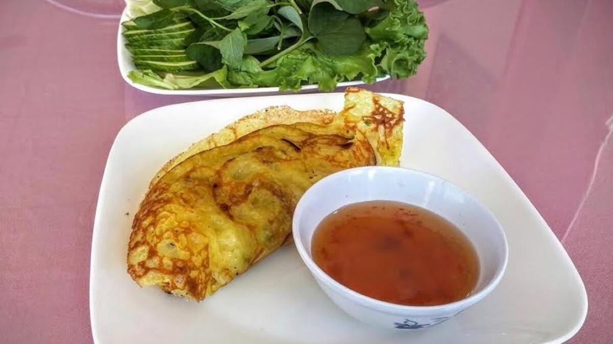 One of the best dishes at China Express is the banh xeo, a yellow egg pancake that’s served with romaine lettuce leaves.