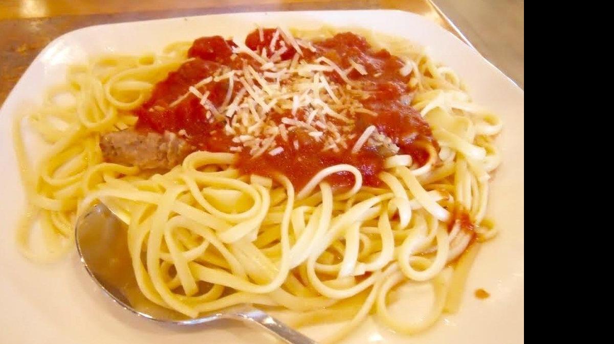 
A serving of linguine comes with sausage and tomato sauce at the remodeled Sweet Basil.
