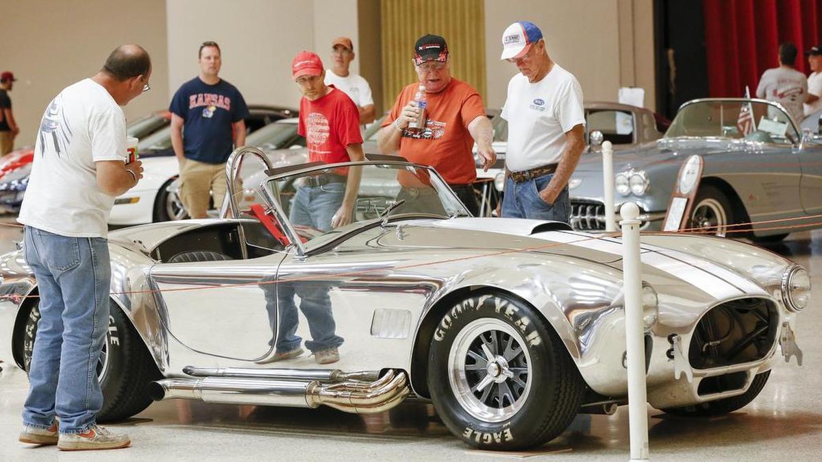 Car enthusiasts check out a 1965 Shelby Cobra inside Century II during the BlackTop Nationals. (Aug. 21, 2015)