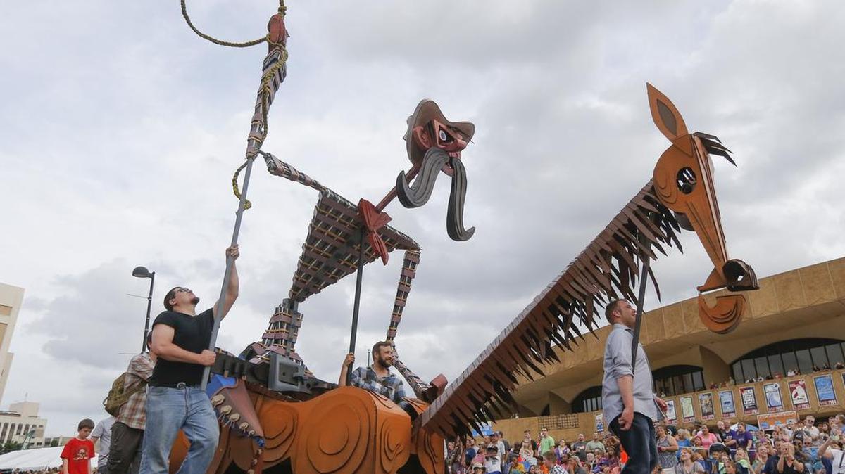 Giant puppets designed by artist Wayne White make their way down Douglas during the Sundown Parade at the 2015 Wichita River Festival. Total attendance at Riverfest 2015 was 410,000, according to festival officials, an increase of 8 percent over 2014.