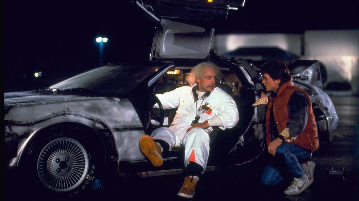 This photo provided by Universal Pictures Home Entertainment shows Christopher Lloyd, left, as Dr. Emmett Brown, and Michael J. Fox as Marty McFly in the 1985 film, "Back to the Future." Wednesday's so-called "Back to the Future" Day marks the date - Oct. 21, 2015 - that characters McFly, Brown and Jennifer Parker famously journeyed to the future in the film trilogy's second installment in 1989. "The Back to the Future 30th Anniversary Trilogy" and "Back to the Future: The Complete Adventures" release on Blu-ray and DVD on Oct. 20.