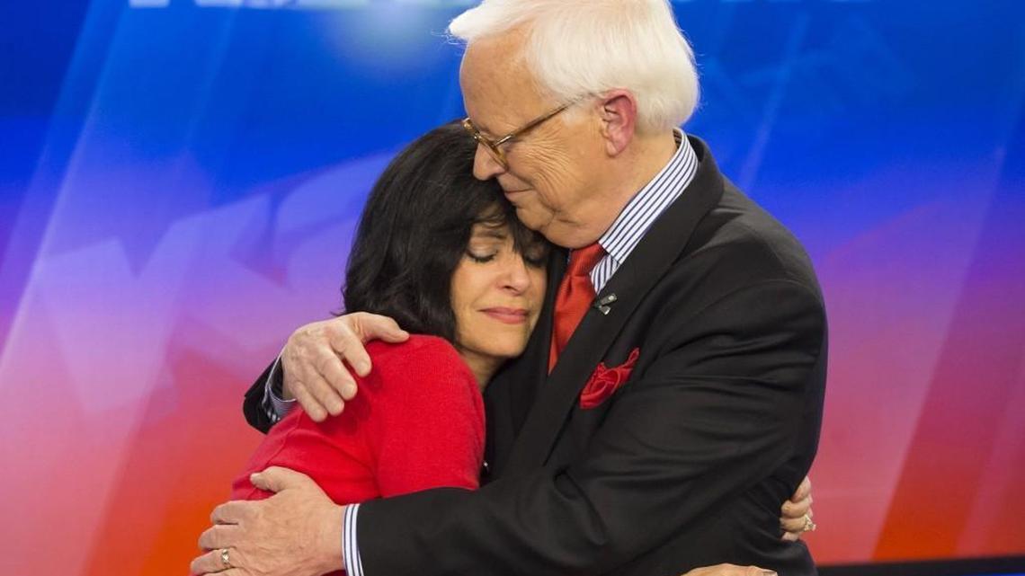 Susan Peters hugs Larry Hatteberg after he signed off for the final time in 2014. Peters announced Thursday she is leaving KAKE in May.