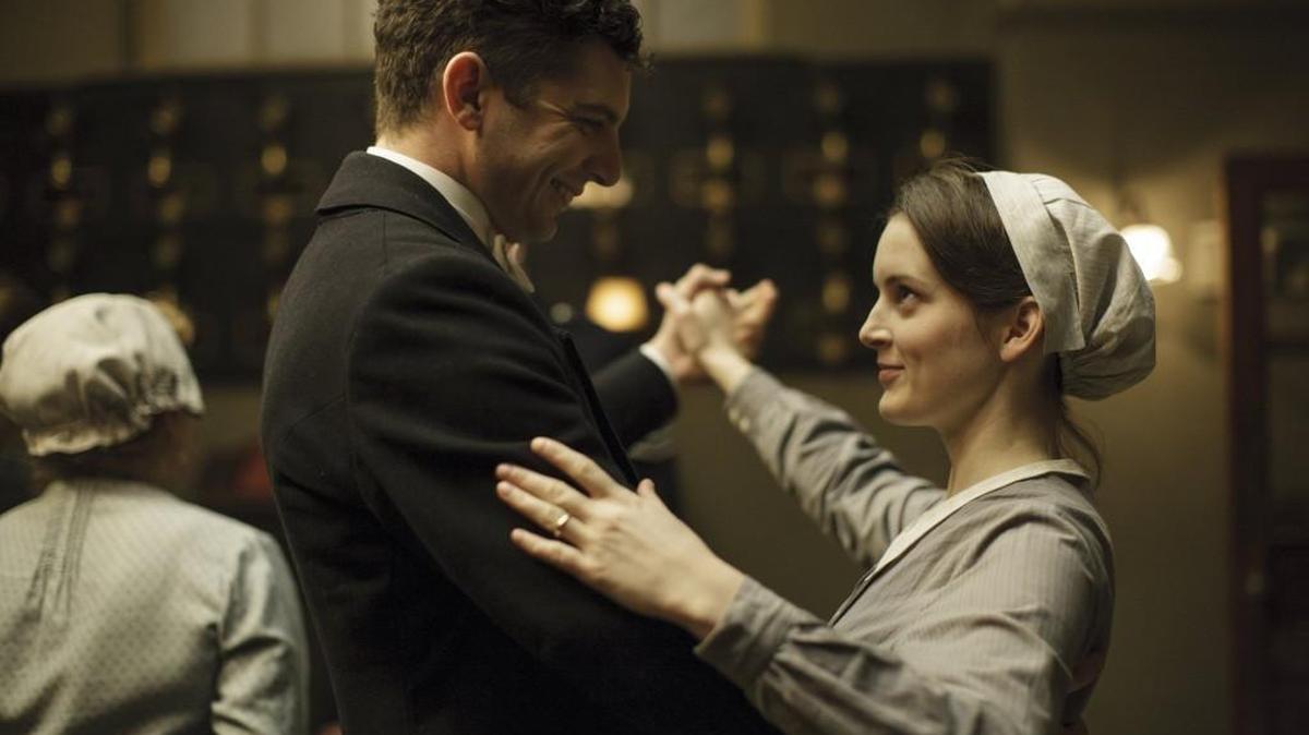 This image released by PBS shows Michael Fox as Andy Parker, left, and Sophie McShera as Daisy Mason in a scene from the final season of “Downton Abbey.” The series finale airs in the U.S. on Sunday. (Nick Briggs/Carnival Film & Television Limited 2015 for MASTERPIECE via AP)