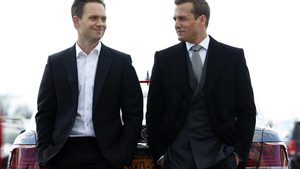 Patrick J. Adams, left, and Gabriel Macht appear in a scene from “Suits.” The TV drama series has been renewed for its seventh season.