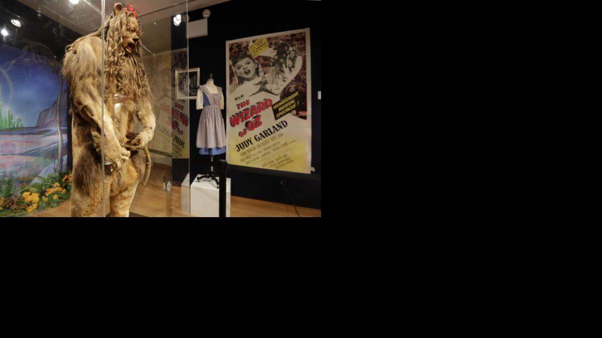 
This Nov. 21, 2014 photo shows Bert Lahr's Cowardly Lion costume and a three-sheet poster from "The Wizard of Oz," part of the "There's No Place Like Hollywood" movie memorabilia auction at Bonhams auction house in New York. Lahr’s costume was auctioned with other Hollywood items Monday, Nov. 24, 2014, in New York. 
