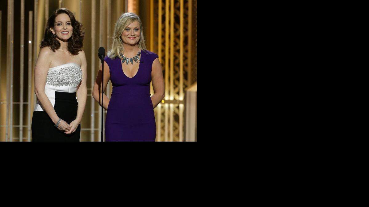 
Co-hosts Tina Fey, left, and Amy Poehler open the 72nd Annual Golden Globe Awards on Sunday at the Beverly Hilton Hotel in Beverly Hills, Calif.
