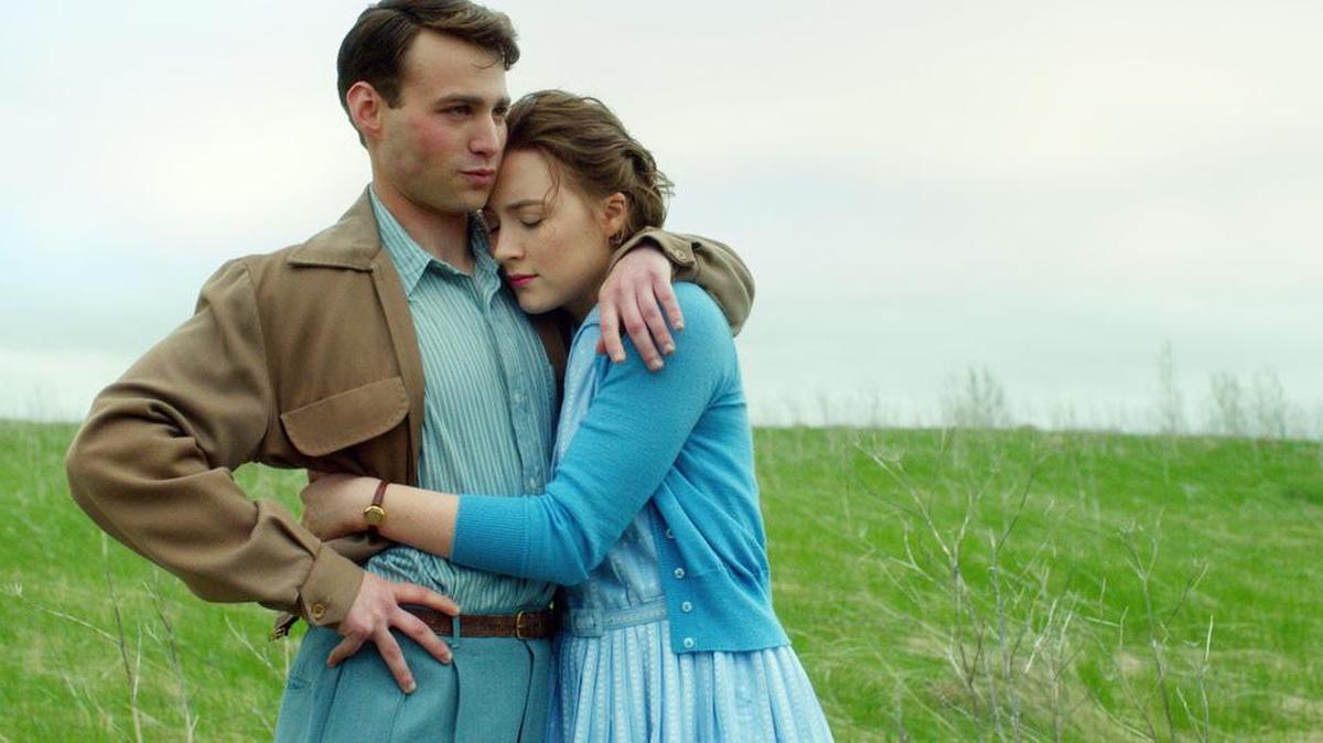 Tony (Emory Cohen) begins a courtship with Eilis (Saoirse Ronan) in “Brooklyn.”