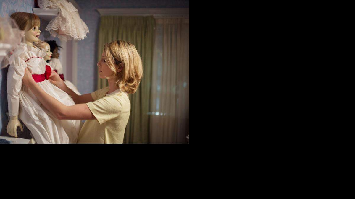 
Mia (Annabelle Wallis) discovers a strange doll in “Annabelle,” opening Oct. 3.
