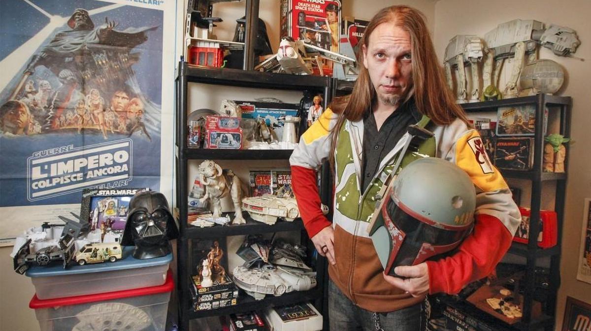 Randall Aviks in his west Wichita apartment with his “Star Wars” memorabilia Tuesday. (Dec. 8, 2015)