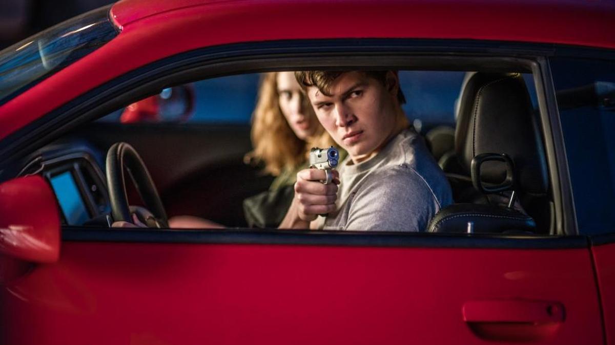 Baby (Ansel Elgort) and Debora (Lily James) try to make a break for it in “Baby Driver.”