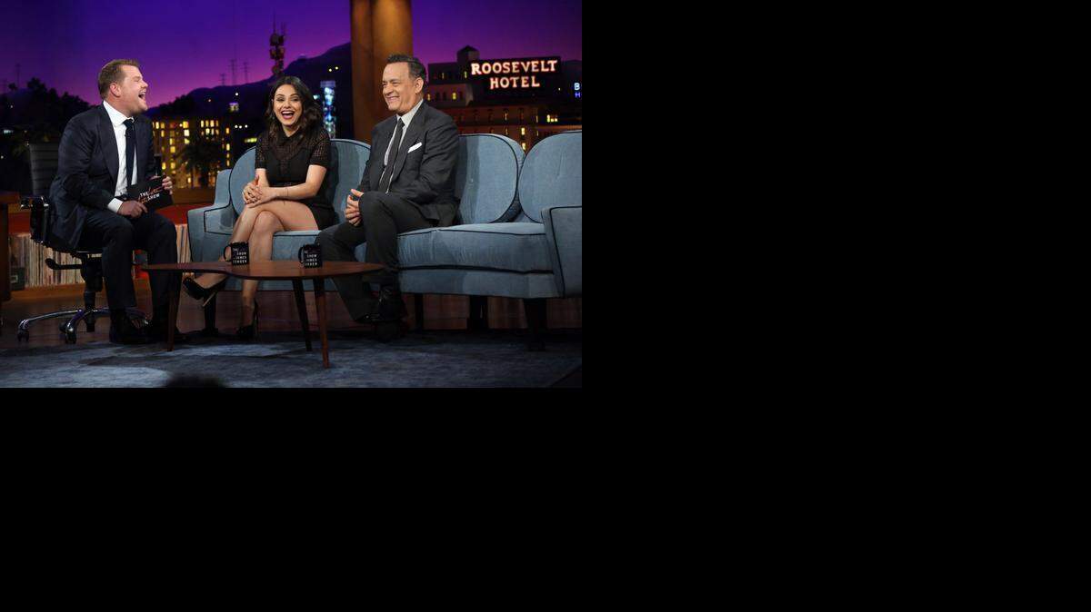 
This photo released by CBS shows James Corden, left, chatting with his first guests, Tom Hanks, right, and Mila Kunis, on "The Late Late Show with James Corden," premiering Monday, March 23, 2015 (12:37 -- 1:37 a.m. ET/PT) on the CBS Television Network. (AP Photo/CBS, Monty Brinton) 
