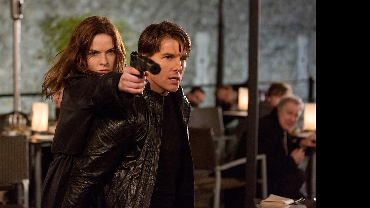 
A spy (Rebecca Ferguson) teams up with Ethan Hunt (Tom Cruise) in Mission: Impossible - Rogue Nation.” 
