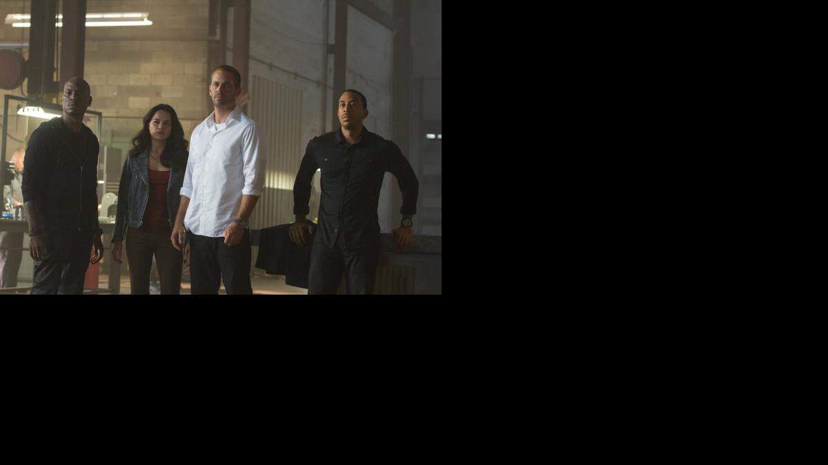 
“Furious 7” features Tyrese Gibson as Roman, Michelle Rodriguez as Letty, Paul Walker as Brian, and Chris Ludacris as Tej.
