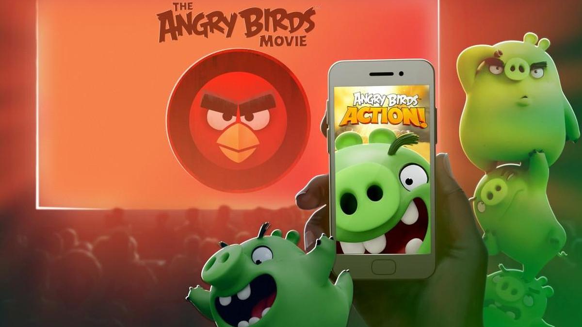 This image released by Rovio Entertainment shows an animated visual cue for the movie magic interaction that will happen between the new game, “Angry Birds Action!,” and the upcoming film, “The Angry Birds Movie.” A level set on Piggy Island, home to the Angry Birds’ snout-faced adversaries, can only be unlocked if players pluck out their mobile devices and zap a code displayed during the film’s credits when it debuts May 20. (Rovio Entertainment via AP)