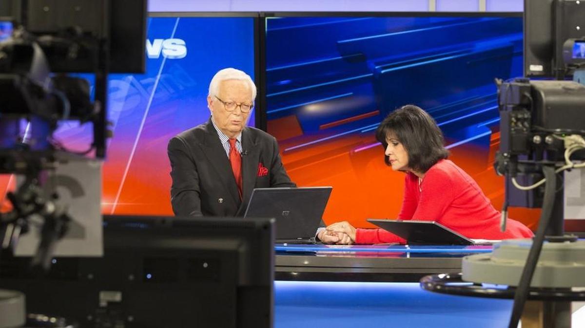 Larry Hatteberg and co-anchor Susan Peters wait for their final broadcast together to begin during the 10 p.m. broadcast in the KAKE Television studio in 2014, when Hatteberg retired. Now Hatteberg and Peters will be together again for a revival of “Hatteberg’s People” on KPTS.