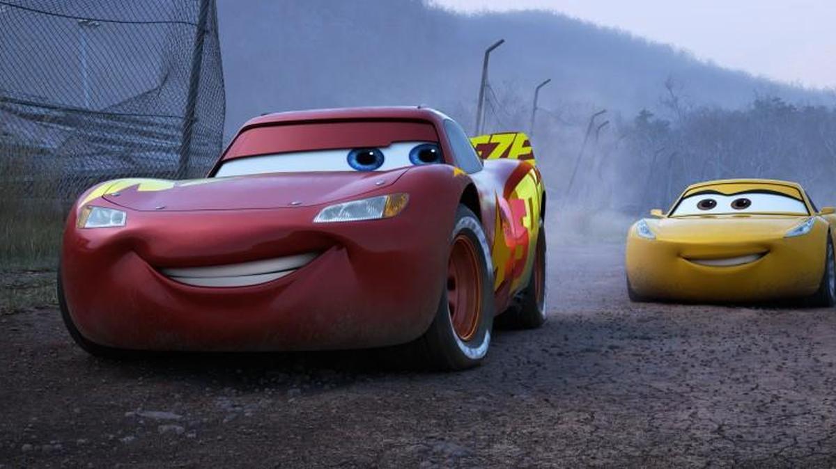 Lightning McQueen (voice of Owen Wilson, left) teams up with tech-savvy, unconventional trainer Cruz Ramirez (Cristela Alonzo) to fight his way back to the top in “Cars 3.”