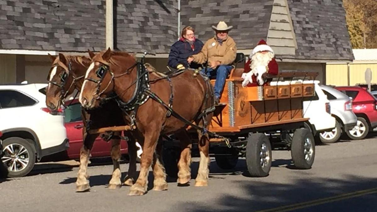 Santa rides through Oxford in a horse-drawn wagon during the town’s Christmas in the Country celebration.