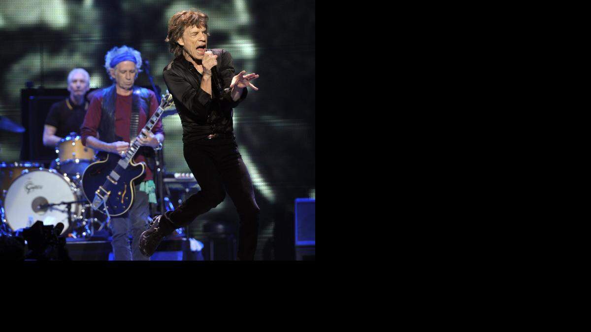 
Mick Jagger, right, Keith Richards, center, and Charlie Watts of the Rolling Stones perform at the kick-off of the band’s “50 and Counting” tour at the Staples Center in May 2013 in Los Angeles. On Oct. 25, 1964, the Stones made the first of six appearances on “The Ed Sullivan Show.”

