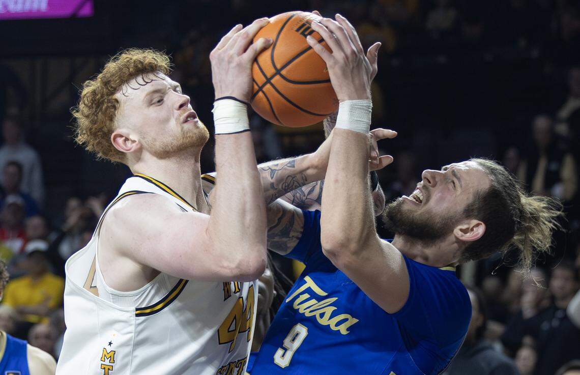 Wichita State’s Will Berg battles Tulsa’s Tyler Behrend for a rebound during the second half at Koch Arena on Saturday night.