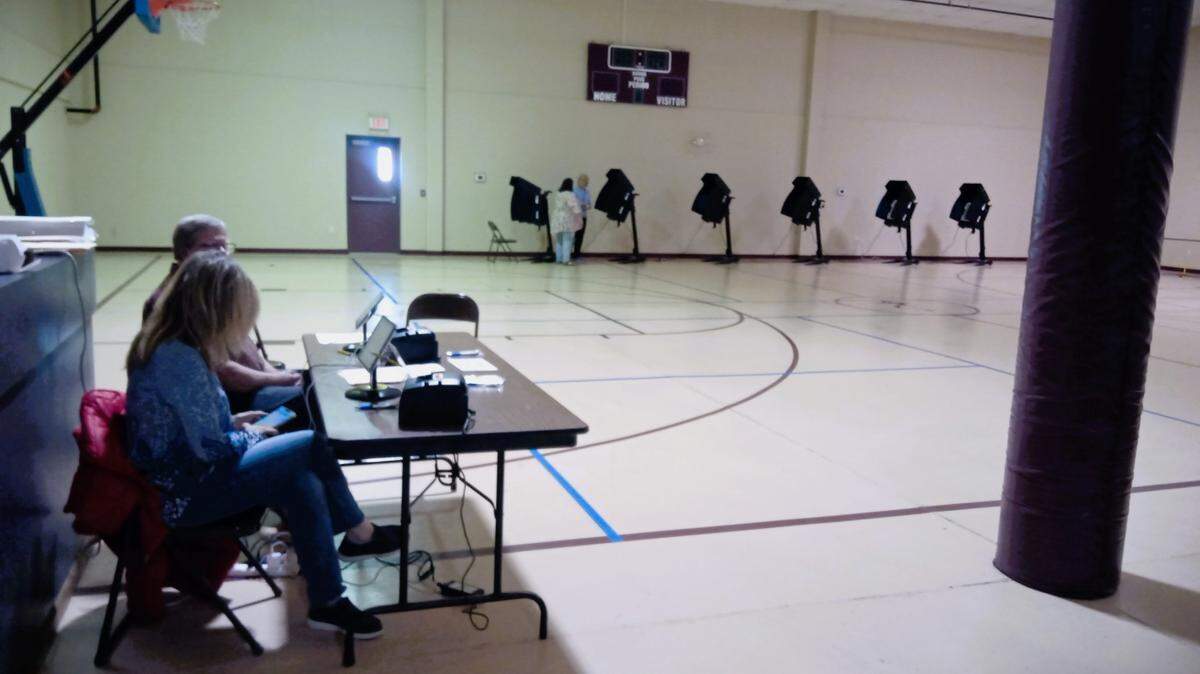 A lonely voter casts a ballot in the Kansas presidential primary at Evidence Church in Wichita..