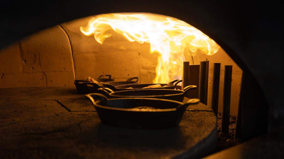 The rotating brick pizza oven at The Hub also cooks steaks in cast iron to perfection.