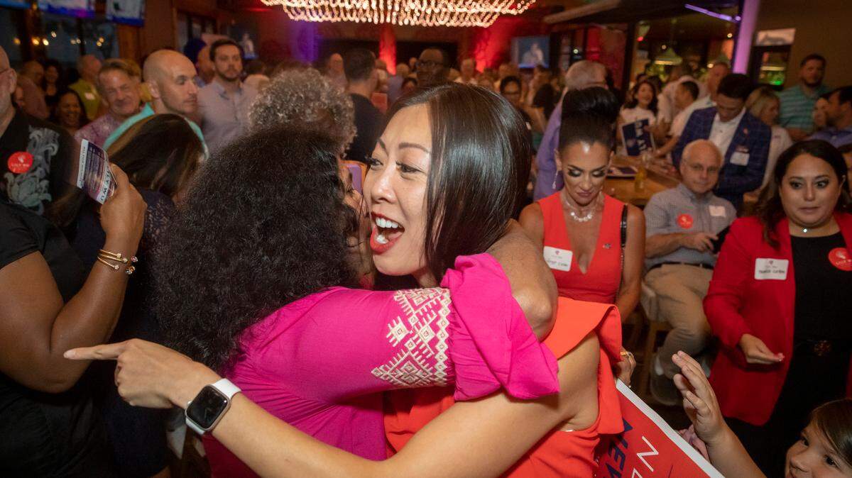 Lily Wu with supporters on Tuesday night after unofficial final results showed she was the top vote-getter in the primary.