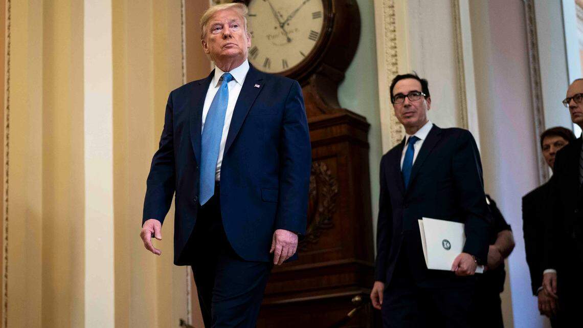President Donald Trump is accompanied by Treasury Secretary Steve Mnuchin as he visits the Capitol on Tuesday, March 10, 2020. Trump is expected to brief Senate Republicans on his ideas for an economic stimulus package to respond to the coronavirus. (Doug Mills/The New York Times)