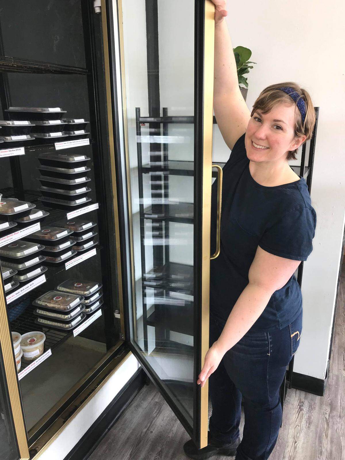 Kira Watt, owner of Perfect Plate, is pictured at The Coop in Derby when it first opened in 2020. She’s among the many vendors who take advantage of the co-op setup and sells her own products from a refrigerated case.