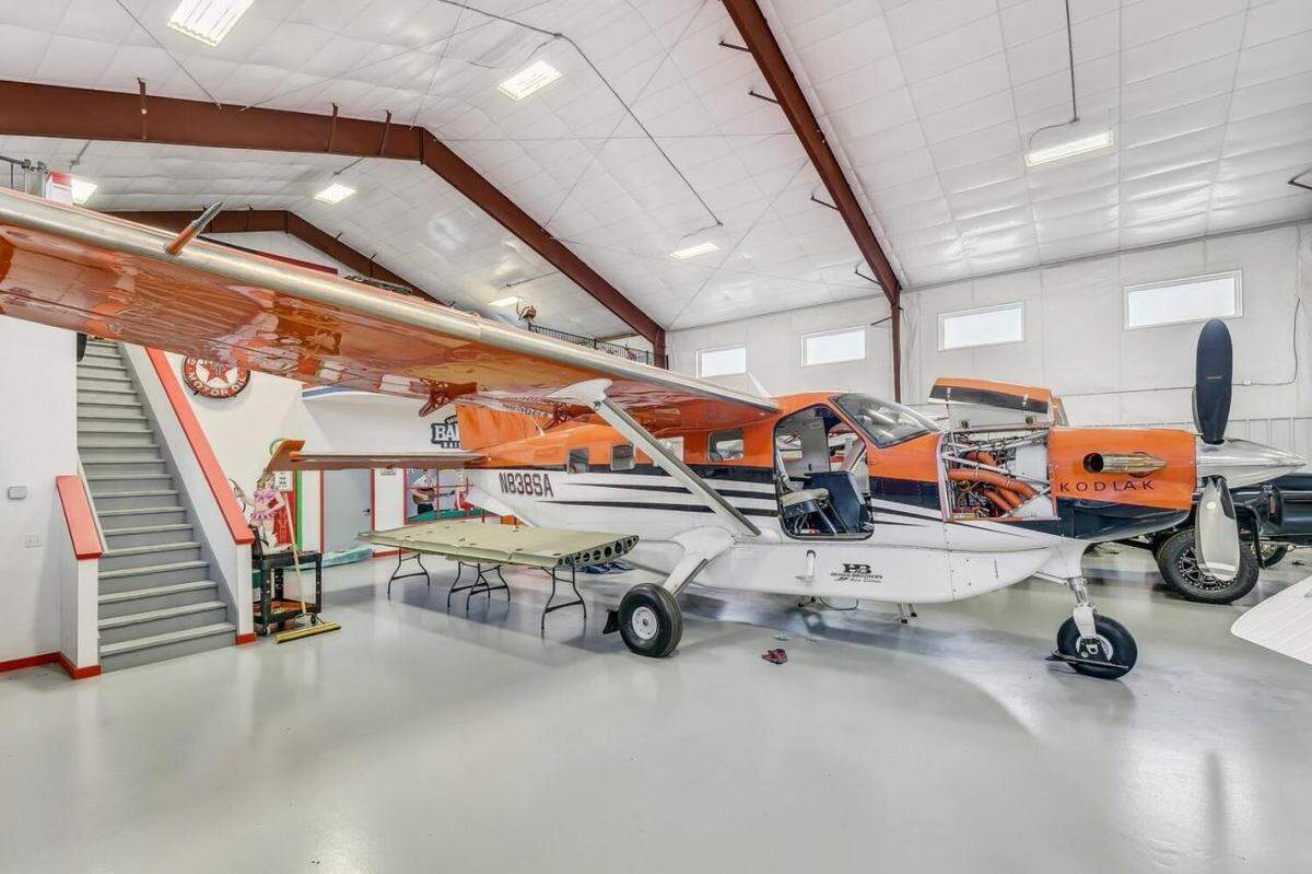 The owner of the Derby home currently stores his airplane in the large storage space, but the listing suggestions it could also be used for cars or other large collectibles.