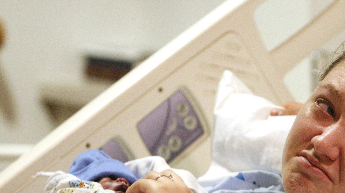Jacie Brown, 18, looks over at her fiance, Bo Harley, 17, while holding her son, Aiden, moments before he died.
