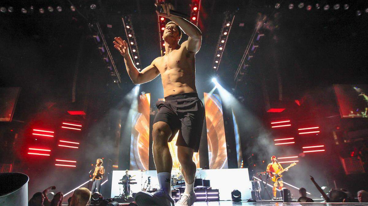 Imagine Dragons’ frontman Dan Reynolds sings to the crowd at the Intrust Bank Arena Monday, July 30, 2018.