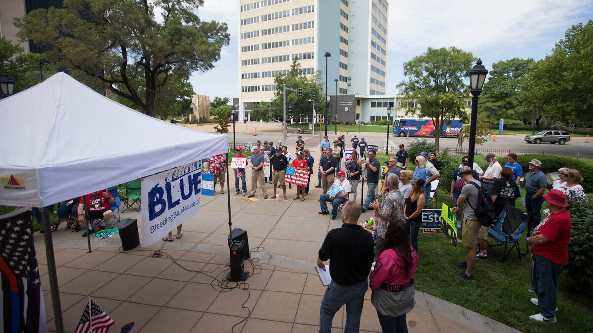About 80 people attended a "Making America Great Again" rally outside the old county courthouse on Saturday.