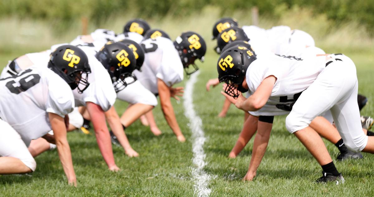 Garden Plain high school football players get ready to run a play during fall practice.