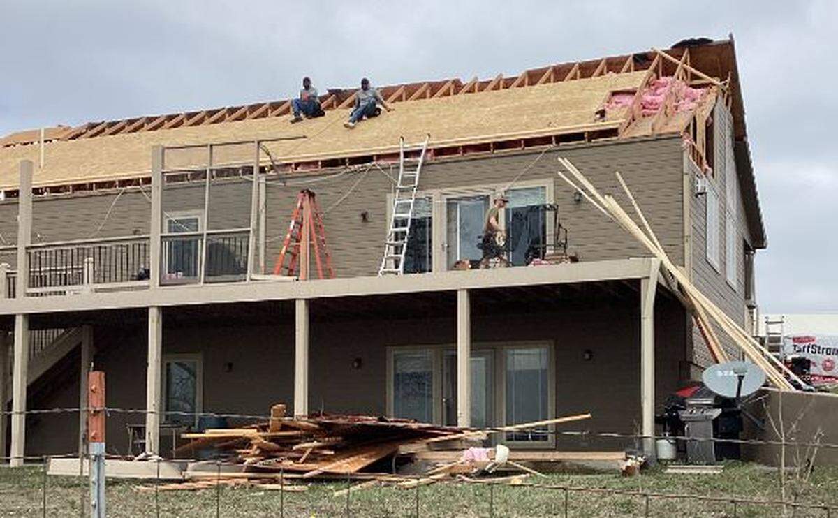 This home had part of its roof and deck ripped off when it was hit by an EF-2 tornado Wednesday night outside of Rossville. 