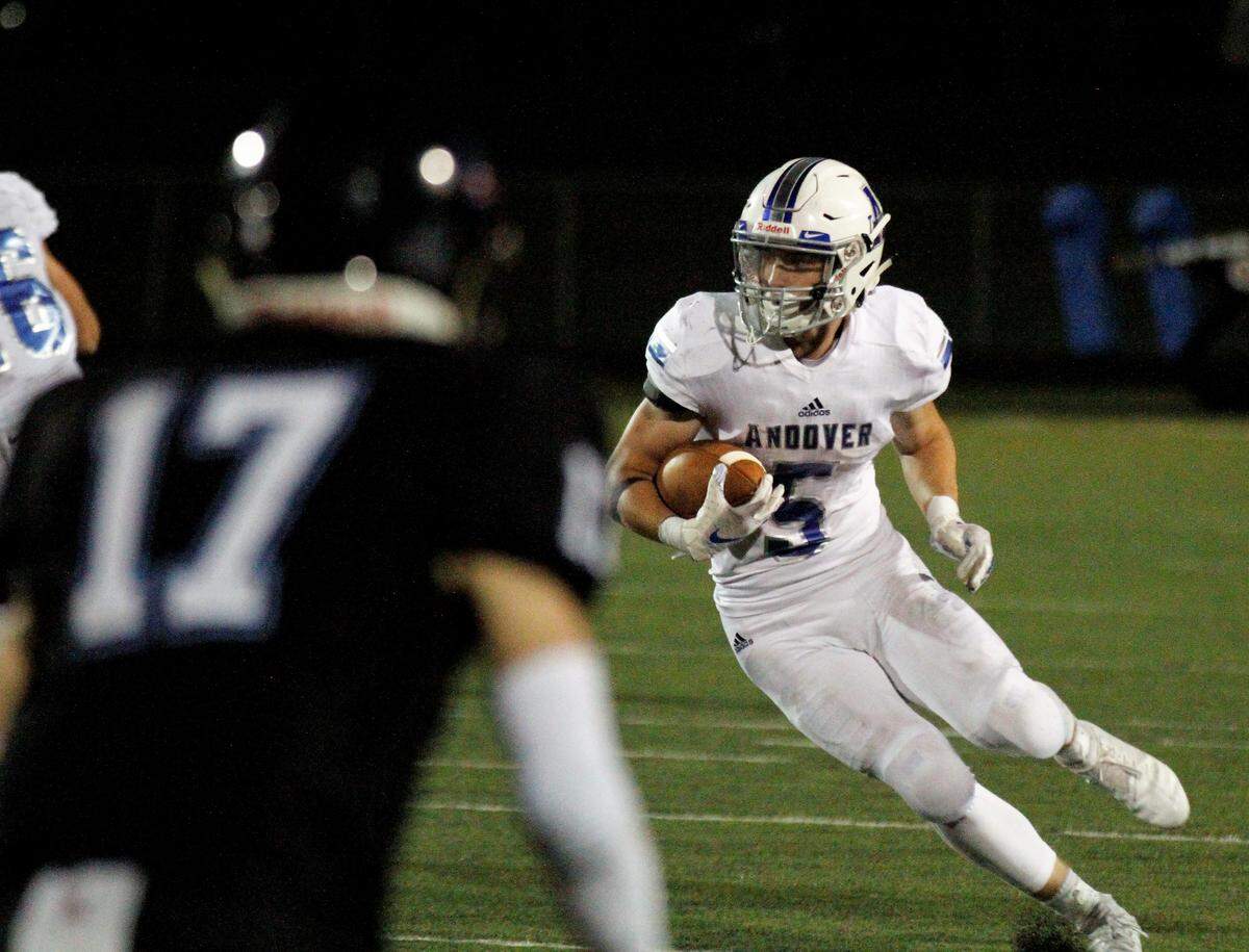 Andover junior running back Peyton Henry looks for a hole during the Trojans’ 30-22 win over Goddard Eisenhower on Thursday night. (Sept. 13, 2018)