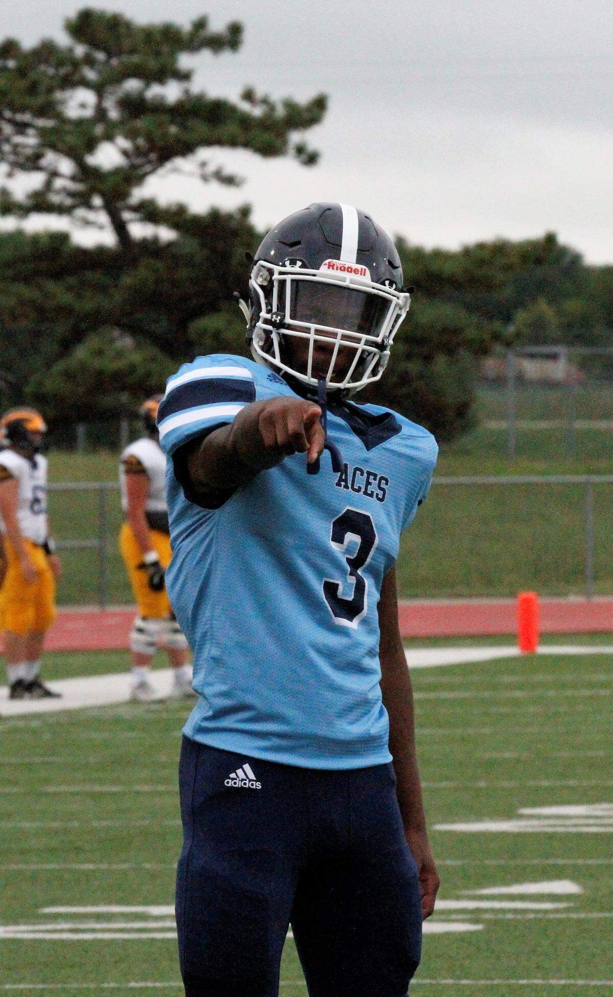 Wichita East junior running back Norman Massey points out the camera before Wichita Northwest’s 56-0 win over the Blue Aces on Thursday night. (Sept. 6, 2018)