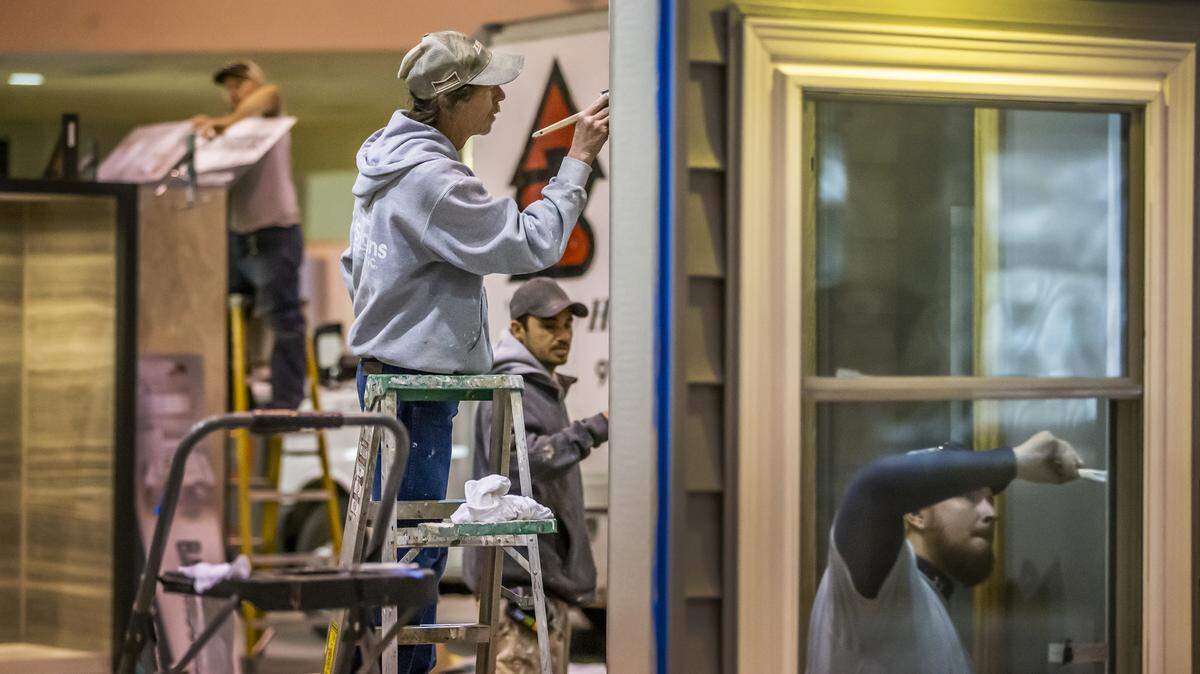 All Seasons Construction workers help set up their display as they get ready for the WABA Home Show in 2020. The show returns this weekend at Century II.