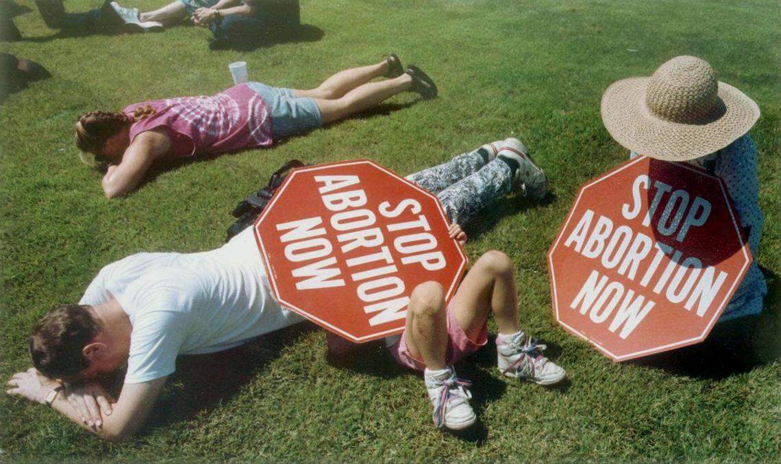 Abortion protesters pray on the lawn of Wichita City Hall during the 1991 Summer of Mercy. They were there in support of jailed protesters.