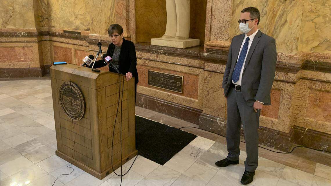 Gov. Laura Kelly criticizes state senators after they rejected her appeals court nominee, Carl Folsom III, right.