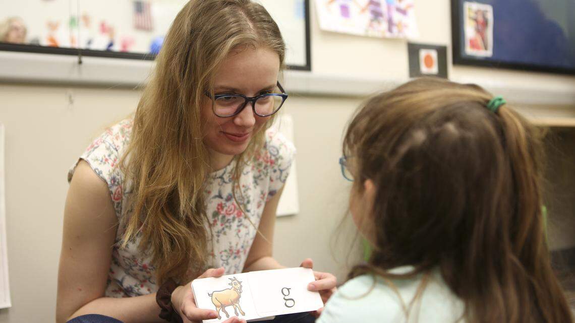 Krissy McKnight, an instructor at Rolph Literacy Academy, works with a student teaching letters. Rolph Literacy Academy uses methods scientifically proven to help dyslexic children process language. (April 12, 2018)