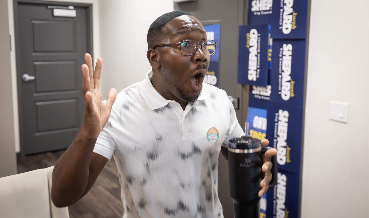 Wichita City Council candidate Joseph Shepard reacts after the second update from the Sedgwick County election office showed him with a commanding lead in the District 1 primary election.