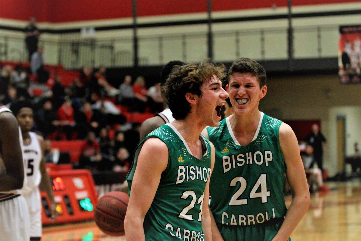 Bishop Carroll’s Tanner Mans lets his emotions fly after scoring an and-one bucket in the fourth quarter of the Golden Eagles’ 61-46 win at Wichita Heights on Tuesday night. (Jan. 8, 2019)