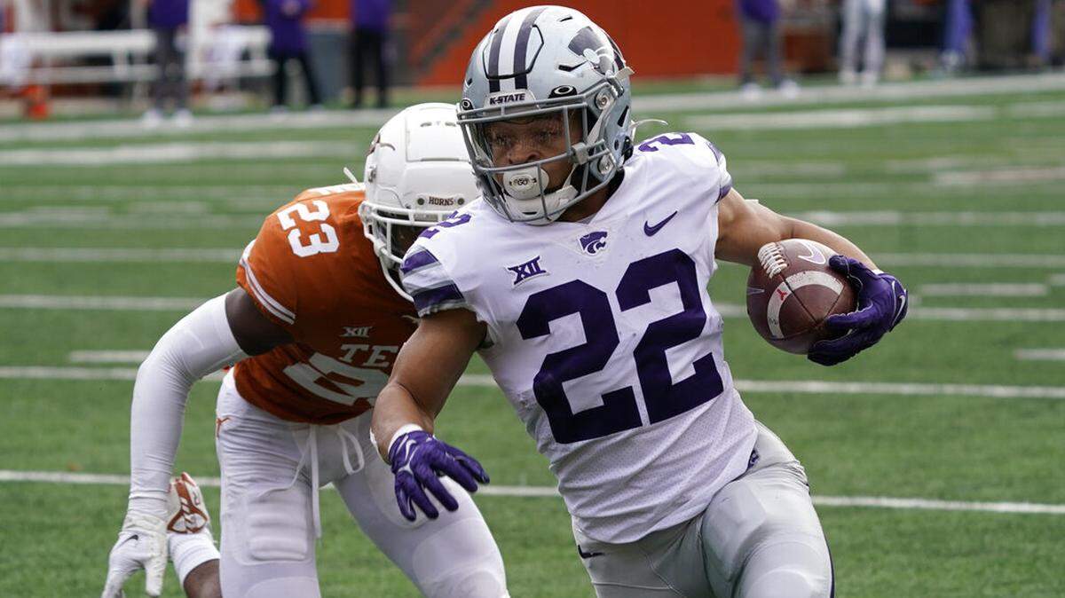 Kansas State running back Deuce Vaughn (22) runs against Texas during the first half of an NCAA college football game in Austin, Texas, Friday, Nov. 26, 2021. (AP Photo/Chuck Burton)