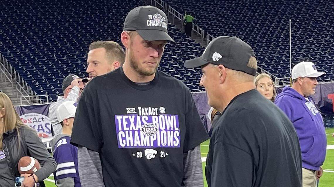 Kansas State assistant coach Collin Klein speaks with Chris Klieman after the Wildcats beat LSU at the Texas Bowl.